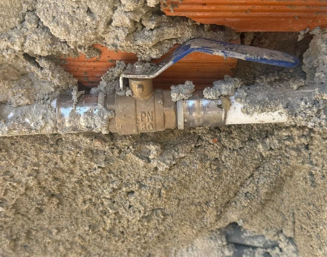 Pipework set into a masonry wall
