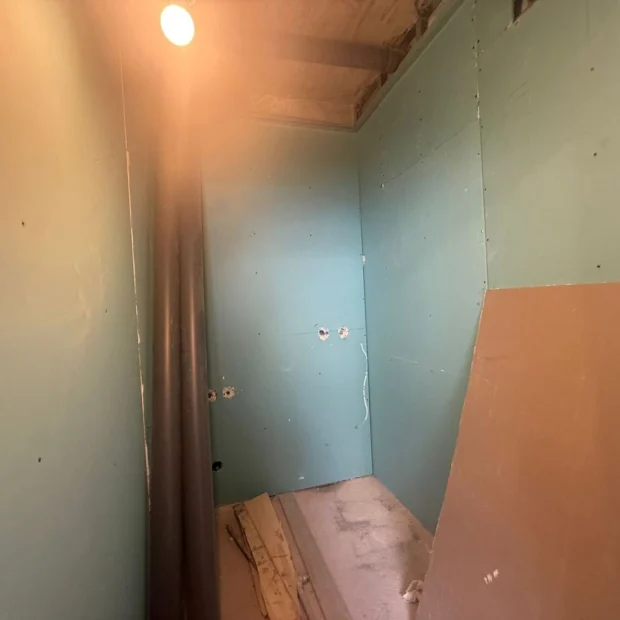 Partition in moisture-resistant board, wet area