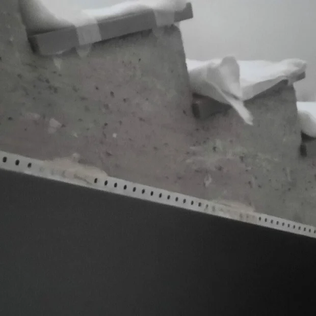 Applying dark microcement to a flight of stairs