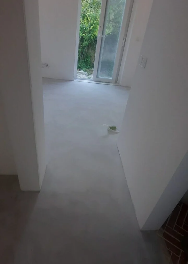After — continuous microcement floor laid