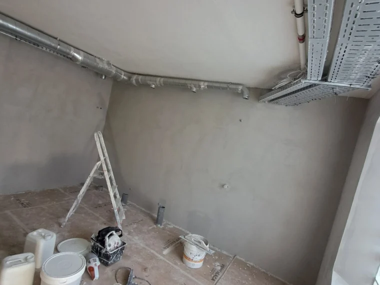 Microcement walls in a wet area, application under way