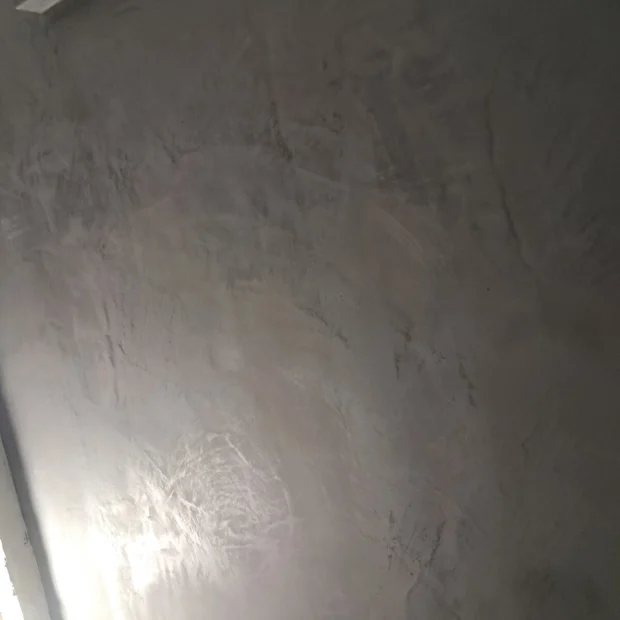 The texture of microcement on a finished wall